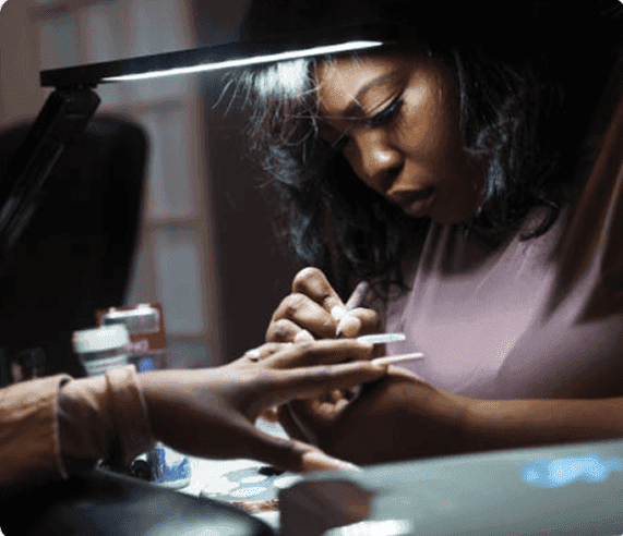 Nail technician at work